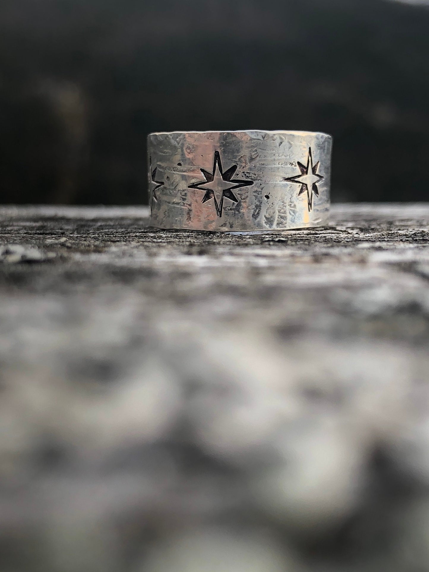 Sterling silver wide band compass rose north star ring with texture.