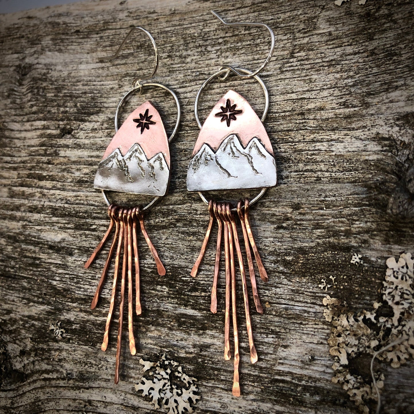 Copper and silver mountain earring with north star compass rose and fringe