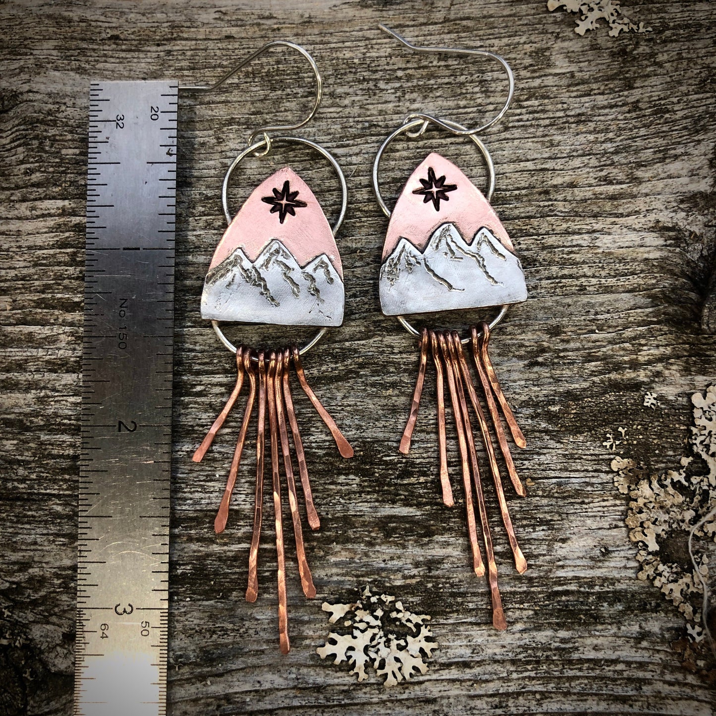 Copper and silver mountain earring with north star compass rose and fringe