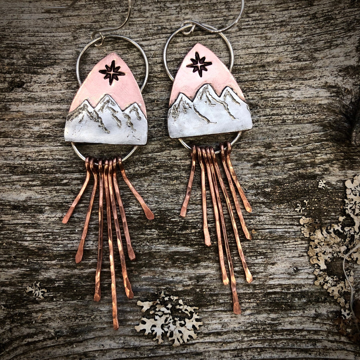 Copper and silver mountain earring with north star compass rose and fringe